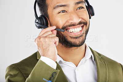 Buy stock photo Happy asian man, call center and headphones in telemarketing, customer service or support against a white studio background. Friendly businessman, consultant or agent smile in online advice or help