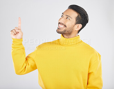 Buy stock photo Announcement, pointing and thinking man with promotion, deal and logo isolated in a studio white background with smile. Choice, ambassador and happy person showing advertising, news or notification