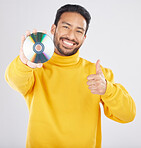 Man, portrait and CD with thumbs up and happy from music of DVD in studio. Smile, motivation and like emoji hand sign of a male person with white background and holding multimedia disk of audio