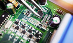 Motherboard, microchip and engineering closeup with electric maintenance of circuit board. Developer, IT and dashboard for electrical hardware update and technician tools for information technology