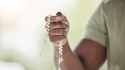 Buy stock photo Rosary, man hands and prayer beads in a home with hop, christian praise and religion. Praying, necklace and worship in a house with hope, gratitude and spiritual guide for faith support and healing