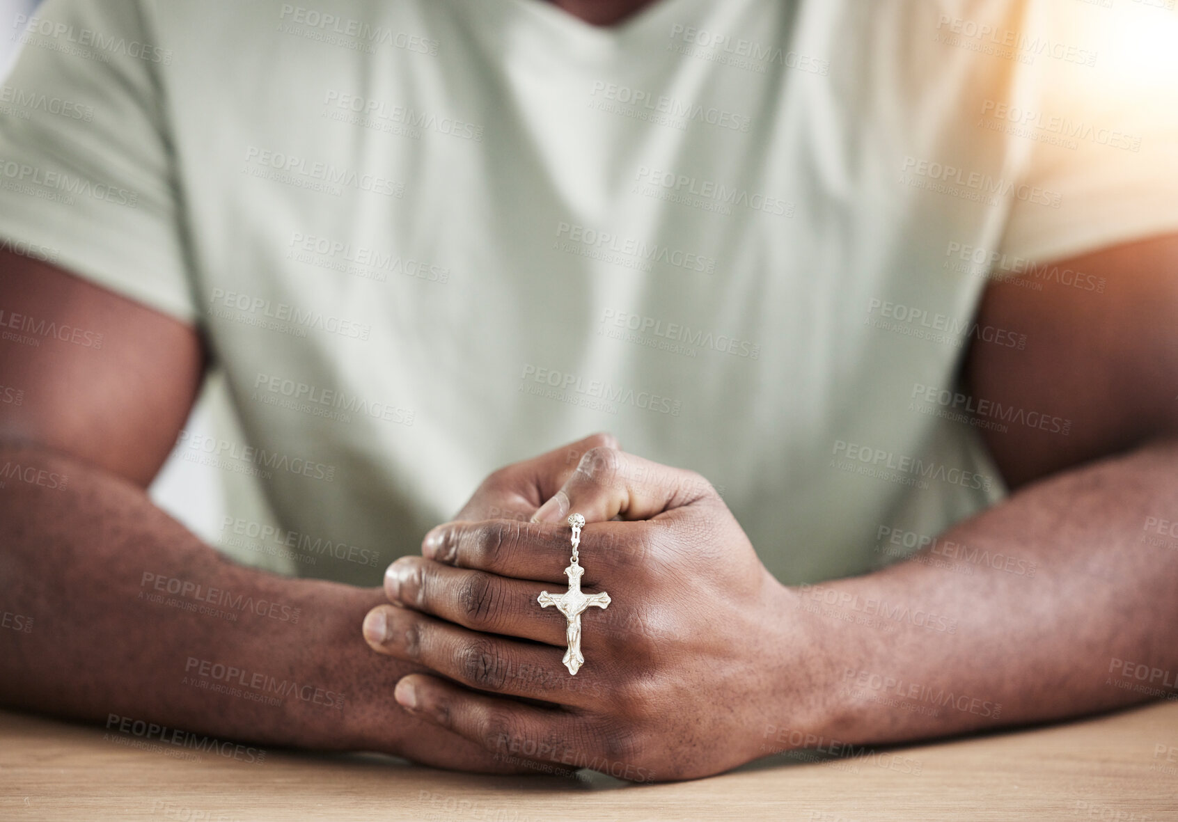 Buy stock photo Crucifix cross, man hands and prayer beads in home with faith, christian praise and religion. Praying, necklace and worship in house with hope, gratitude and spiritual guide for support and healing