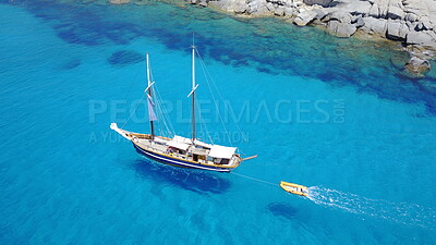 Buy stock photo Yacht, sailing in blue water and summer sun on ocean holiday, relax in freedom and nature. Boat vacation, aerial of travel and tropical cruise on adventure to Greek island with sunshine, fun and sea.