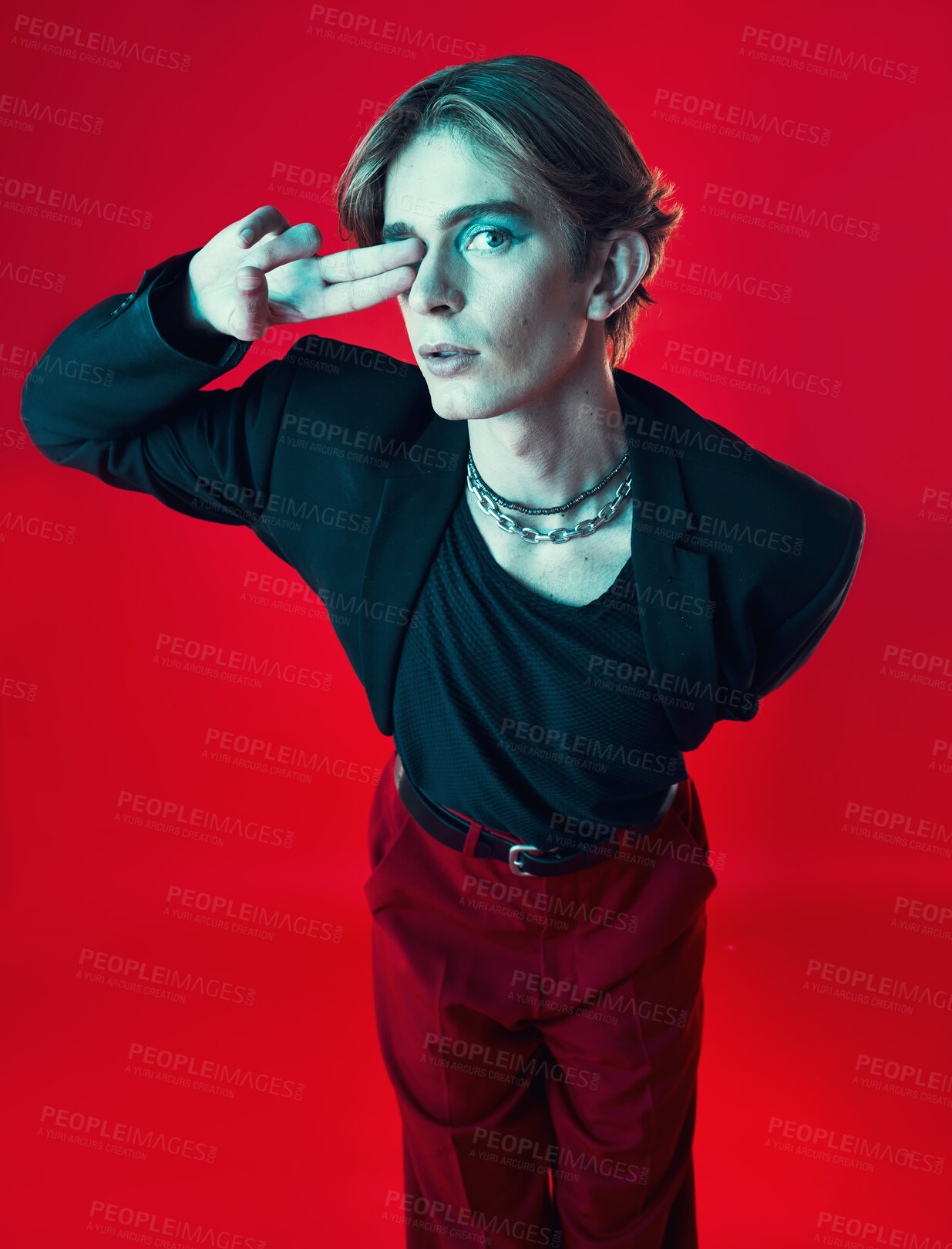 Buy stock photo Gay, man and portrait with fashion, beauty and peace sign on studio red background with unique aesthetic with makeup. Lgbt, style and model with hand in photography, grunge or retro clothing