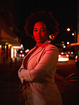 Portrait of black woman, city and night lights, standing in dark street with serious face and waiting for taxi with bokeh. Urban fashion, late travel in Africa and girl in road with neon red lighting