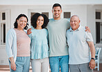 Love, new house and portrait of generations of family standing outdoor of their property or real estate. Smile, happy and young man and woman homeowners with their senior parents by a modern home.