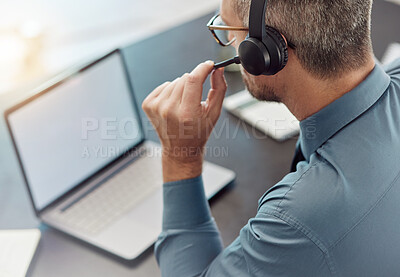 Buy stock photo Businessman, laptop mockup and call center with headphones in customer service or telemarketing at office. Man, consultant or agent in online advice, help or contact us on computer at the workplace