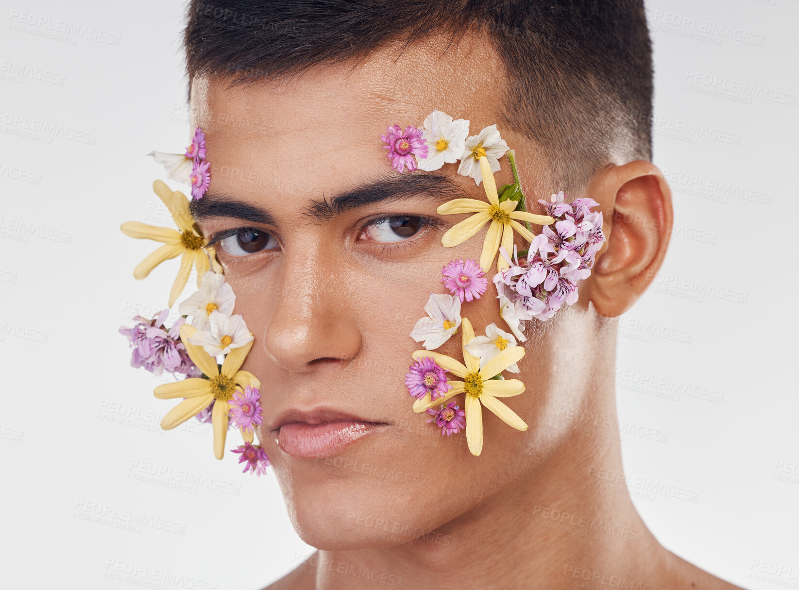 Buy stock photo Face, man and flower, beauty and floral, natural cosmetics and art deco isolated on white background. Nature aesthetic, portrait and dermatology, eco friendly skincare and clean with spring in studio