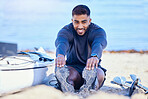 Portrait, beach and man stretching legs to start workout, training and kayak exercise for sports. Happy, athlete and person warm up at ocean to prepare for fitness, healthy body and flexible outdoor