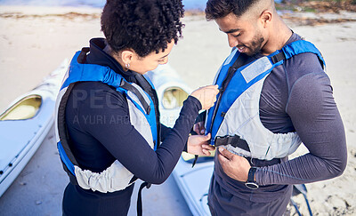 Buy stock photo Life jackets, safety and couple prepare for water, boat and journey on river with protection or people on lake adventure together. Lifejacket, man and woman or instructor helping with sport vest