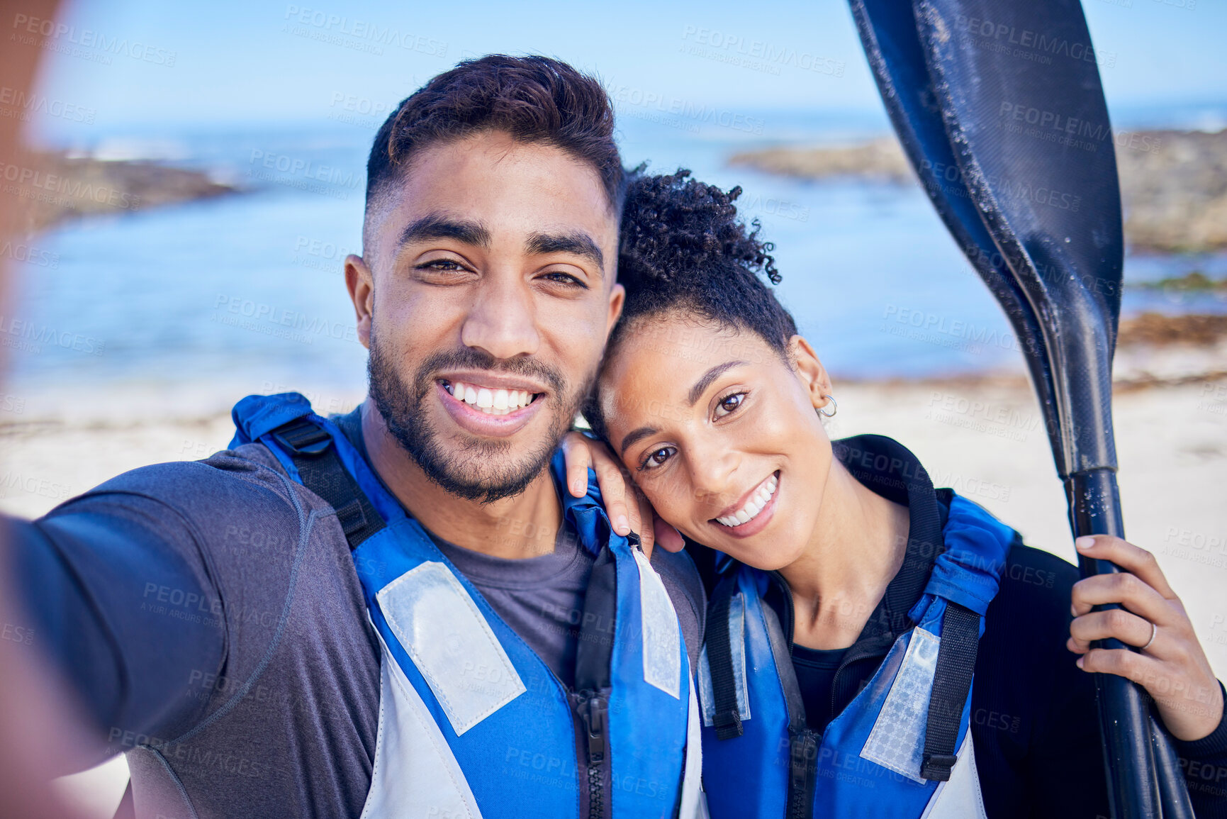 Buy stock photo Selfie, kayak and couple with a love, beach and summer vacation with memory, paddle and picture. Portrait, people and man with woman, water sports and social media with ocean, honeymoon and holiday