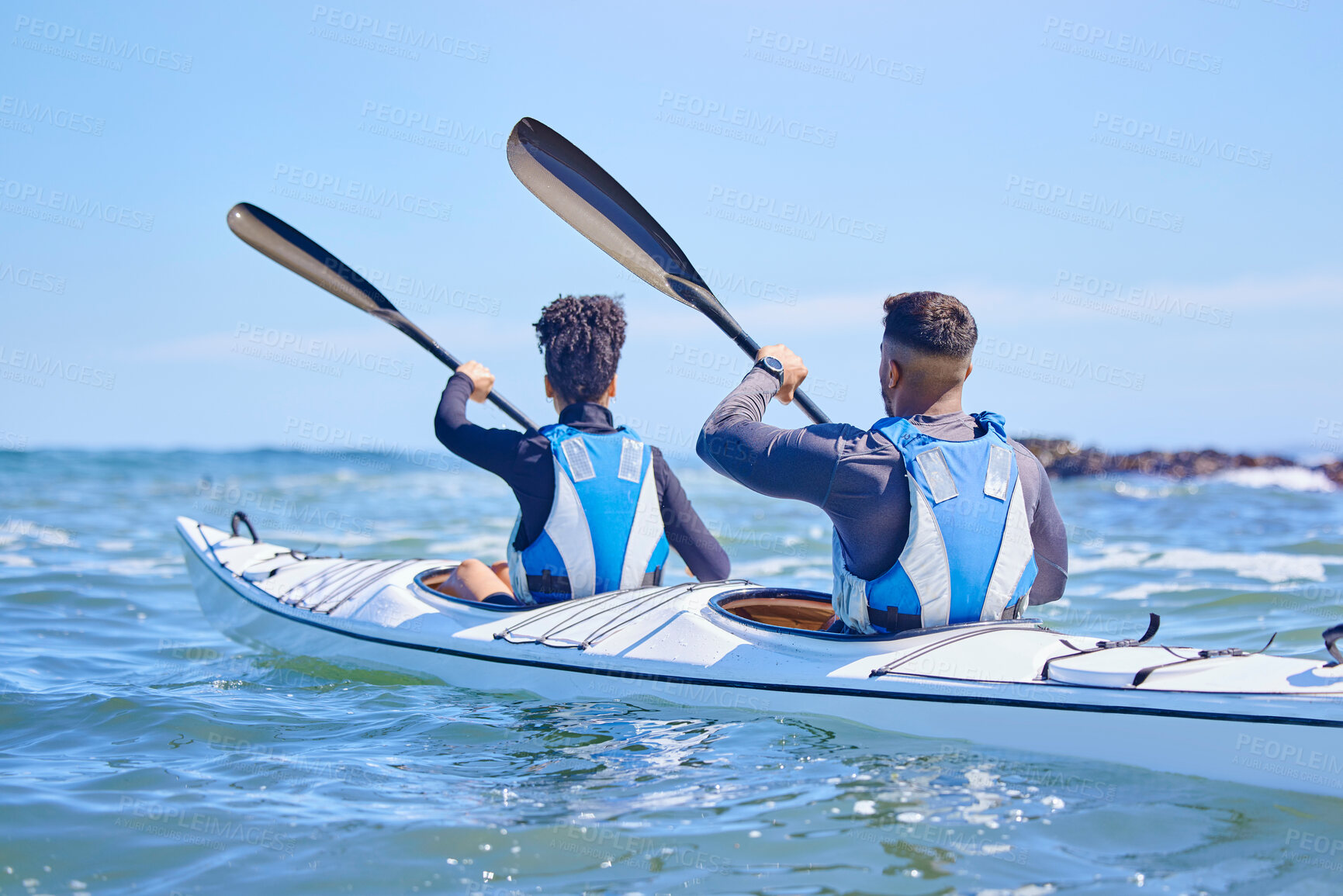 Buy stock photo Water, man and woman in kayak and sports on lake, beach or river for exercise together on vacation. Ocean holiday, adventure and fitness, couple in canoe for training workout in teamwork on blue sky.