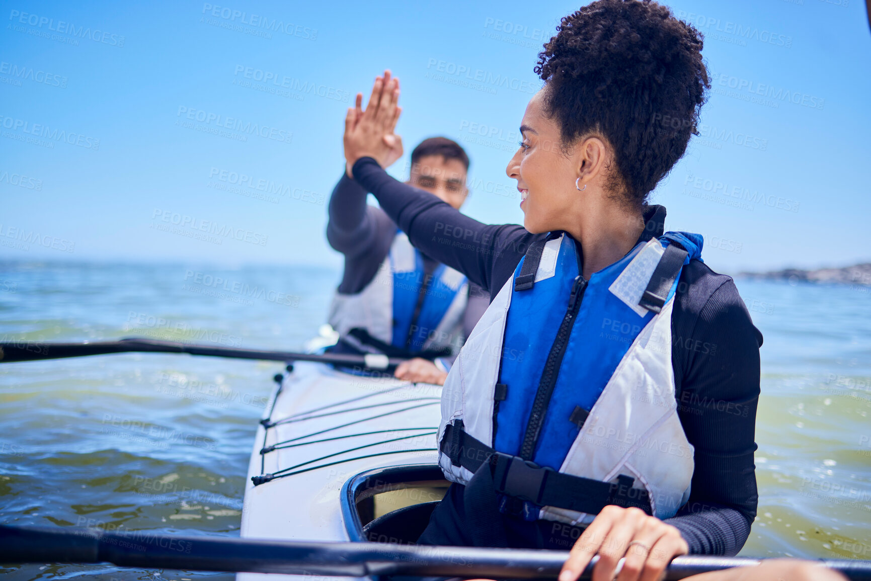 Buy stock photo Water, high five with man and woman in kayak winning at lake, beach or river race for exercise challenge. Ocean holiday, adventure and fitness, happy couple celebrate in canoe for achievement at sea.