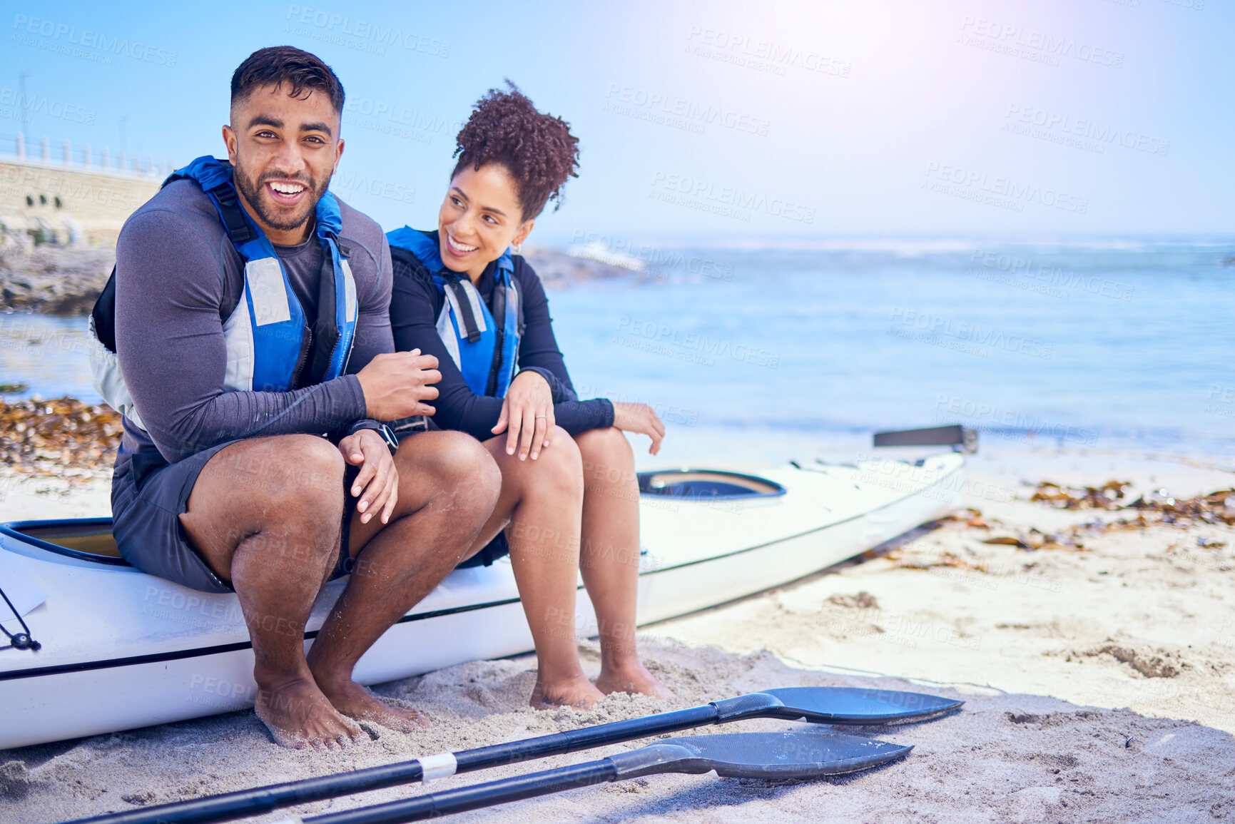 Buy stock photo Couple, portrait and outdoor for kayak or travel at a beach with a partner for teamwork. A happy man and woman with a canoe for sports, water adventure and vacation or freedom with space in nature
