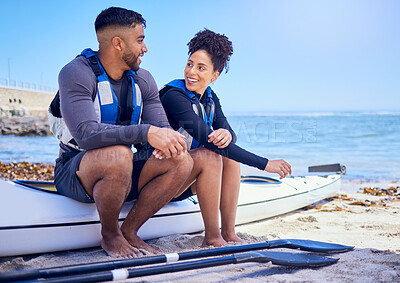 Buy stock photo Couple, kayak and outdoor for travel adventure at a beach with a partner for teamwork. A happy man and woman with a paddle for canoeing, water sports and vacation or fitness while talking in nature