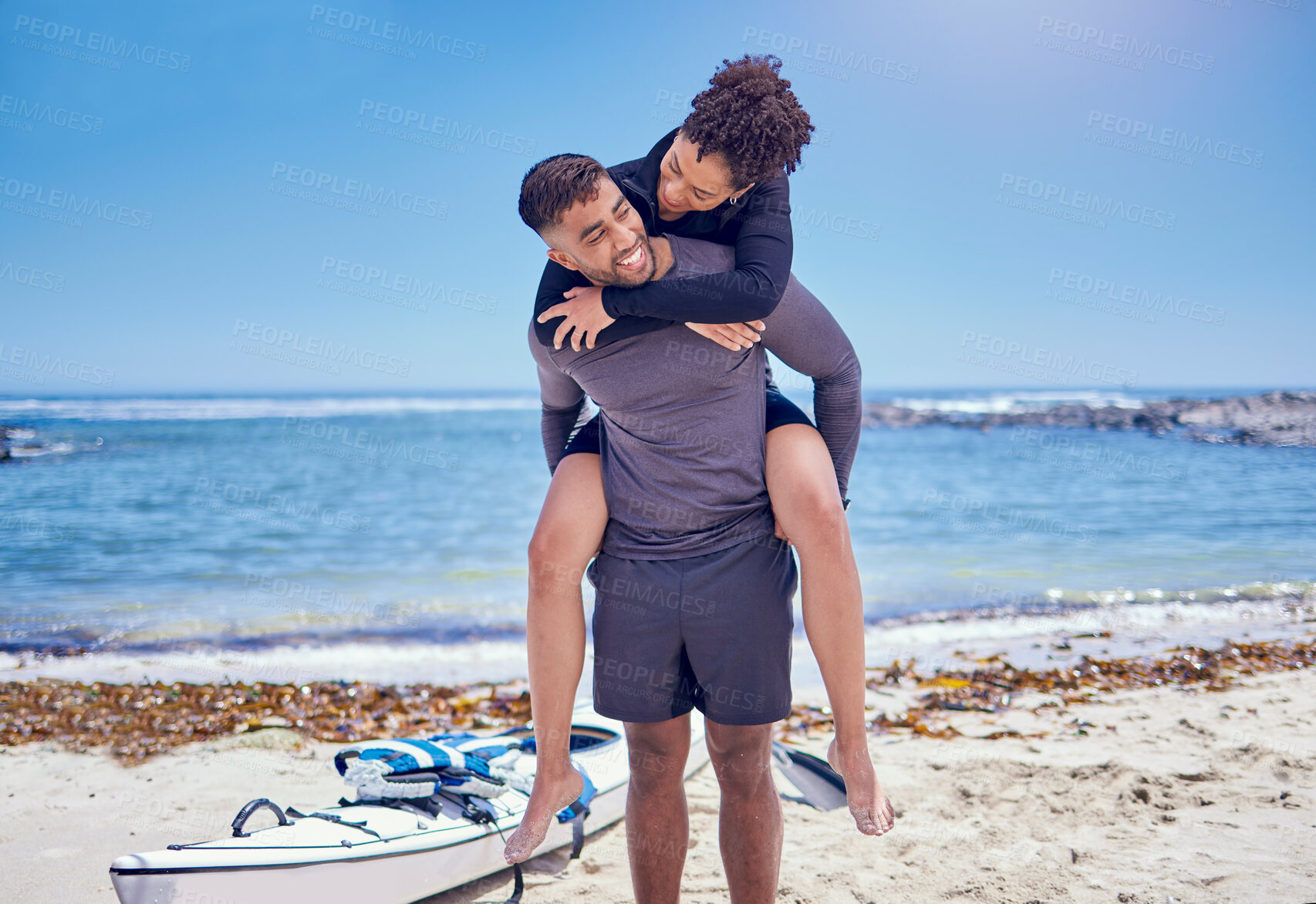 Buy stock photo Beach, fitness and kayak couple piggyback at the ocean for training, bond and workout in nature together. Kayaking, love and man carrying woman at sea for rowing adventure, workout or celebration