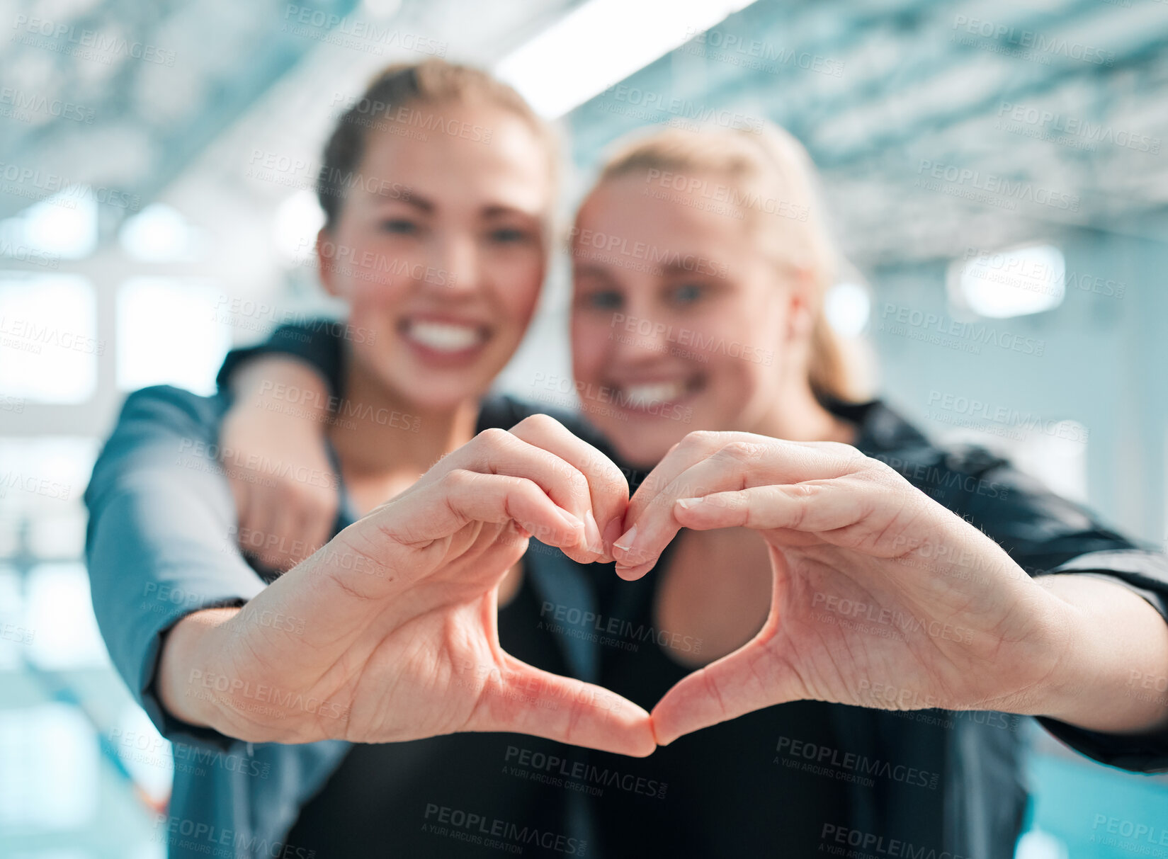 Buy stock photo Happy woman, swimming and heart hands in care, support or teamwork in sport fitness together at pool. Female person or professional swimmer with loving emoji, shape or symbol in team exercise or goal