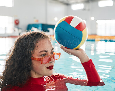 Swimming, water polo and woman with ball, exercise and workout in summer. Sport, sunglasses and person in pool, training and fitness for healthy body, wellness and practice match in competition game