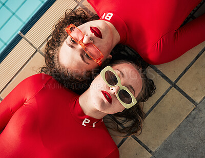 Buy stock photo Women, sunglasses and urban fashion at a pool with gen z, hipster and style of girl friends with top view. Red clothing, cool and trendy glasses with young people on a floor with student model