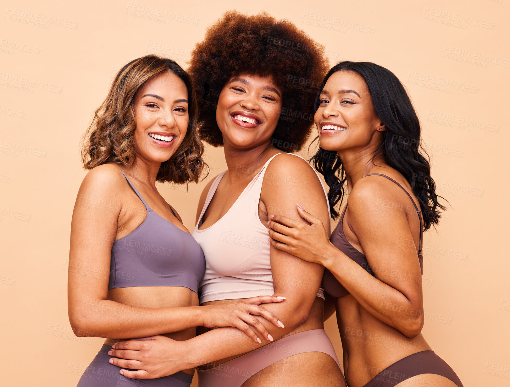 Buy stock photo Diversity, natural beauty and portrait of happy women with smile, self love or body positivity in studio. Happy face, group of people on beige background in underwear, skincare inclusion in cosmetics