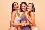 Diversity, natural beauty and portrait of happy women with smile, self love and solidarity in studio. Happy face, group of people on beige background with underwear, global skincare and cosmetics.