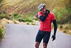 Man, cyclist and neck injury in fitness accident, emergency or broken bone on mountain road in nature. Male person or athlete with sore pain, ache or inflammation on joint in sports fall or cycling
