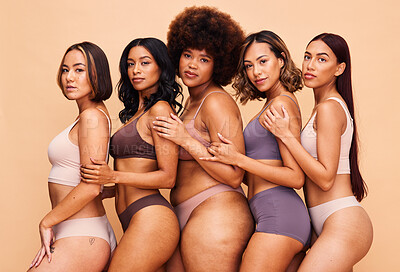 Buy stock photo Underwear, diversity and portrait of women in studio for wellness, beauty and self love campaign. Body positive, natural and people on brown background for confidence, skincare and lingerie inclusion