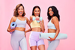 Portrait, group and women with fitness, smile and pilates training on a pink studio background. Funny, girls and friends with exercise, self care and health with wellness, meditation and yoga mat