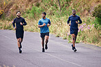 Fitness, men and running friends in a road for training, speed and energy, health and cardio routine in nature. Sports, diversity and man group on practice run for competition, workout or race goal