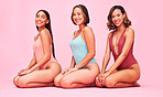 Diversity, bikini and portrait of happy women in studio, sitting together with smile and fun body positivity. Beauty, summer fashion and swimwear models with self love, equality and pink background.