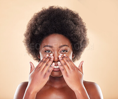 Buy stock photo Black woman, hands on face and beauty in studio for skin care, dermatology and natural glow. Portrait of a happy African model person with afro hair, cosmetics and self love on a beige background