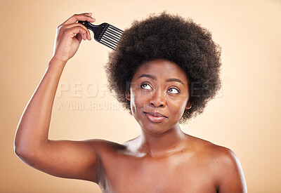 Buy stock photo Afro, hair care and black woman in studio with comb for wellness, beauty and salon hairstyle. Haircare, treatment and happy African girl with curls, tools and beige background for luxury spa routine.