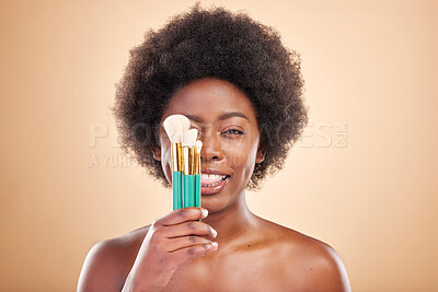 Buy stock photo Portrait, makeup and a black woman with brushes on a studio background for wellness and foundation. Tongue out, beauty and an African person or model with product for facial cosmetics on a backdrop