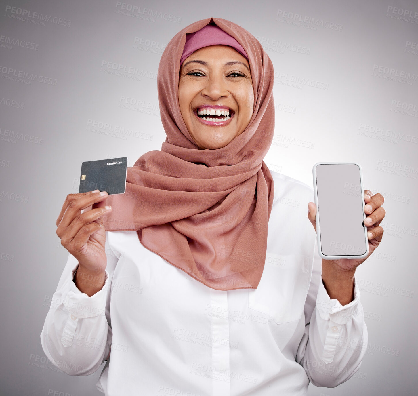 Buy stock photo Muslim woman, credit card and phone screen in fashion e commerce, online shopping or advertising mockup in studio. Islamic person in excited portrait and mobile banking or payment on white background