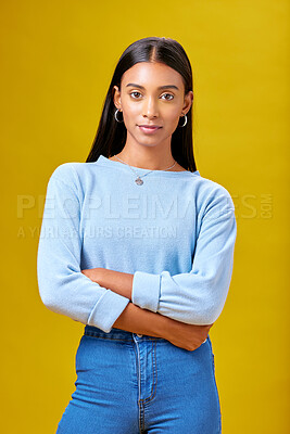 Buy stock photo Arms crossed, fashion and student with portrait of woman in studio for future, pride and  serious. Youth, confident and college with Indian person on yellow background for learning and trendy style