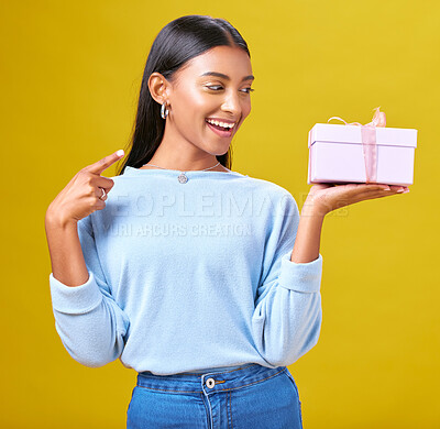Buy stock photo Woman, happy winner and gift box, presentation and prize, giveaway or shopping offer on yellow background. Excited person for present, ribbon package and retail sale, winning or competition in studio