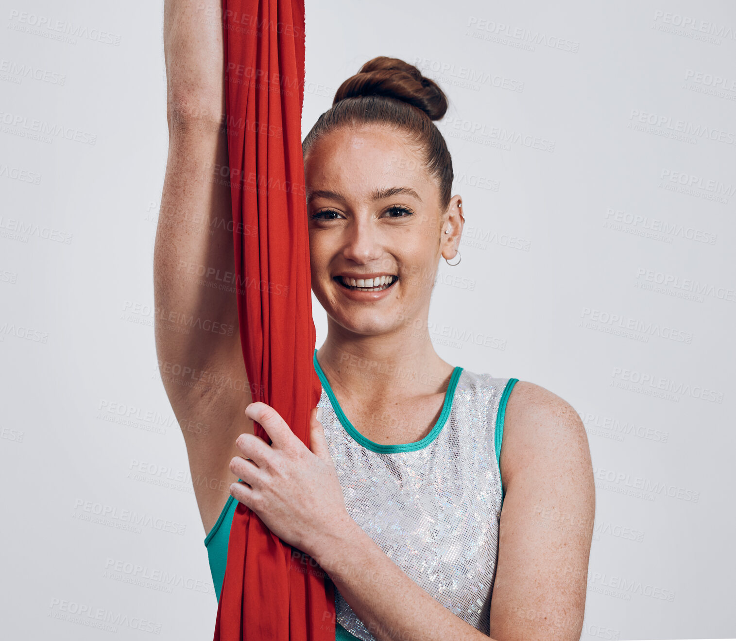 Buy stock photo Portrait, ribbon dancer and competition with a woman in studio on a gray background for routine training. Fitness, smile and energy with a happy athlete holding fabric for a performance showcase