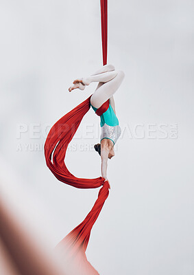 Aerial, woman gymnast and ribbon for sport performance with flexibility and athlete with white background. Workout, exercise and gymnastics with balance, art and dance with acrobat competition