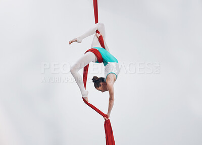 Aerial, woman gymnast fitness and sport performance with girl flexibility and athlete with white background. Workout, exercise and gymnastics with balance, art and dance with acrobat competition