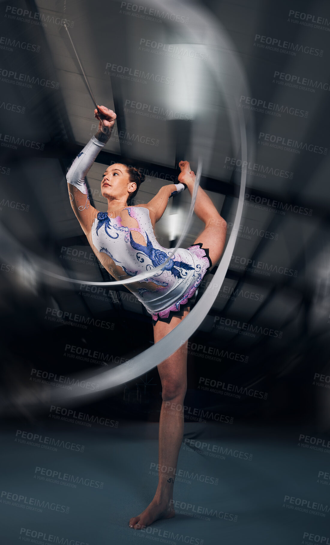 Buy stock photo Woman, dancer and motion for ribbon gymnastics in competition, sports performance or concert in dark arena. Flexible athlete, balance and stretching for creative training, talent or rhythm in contest