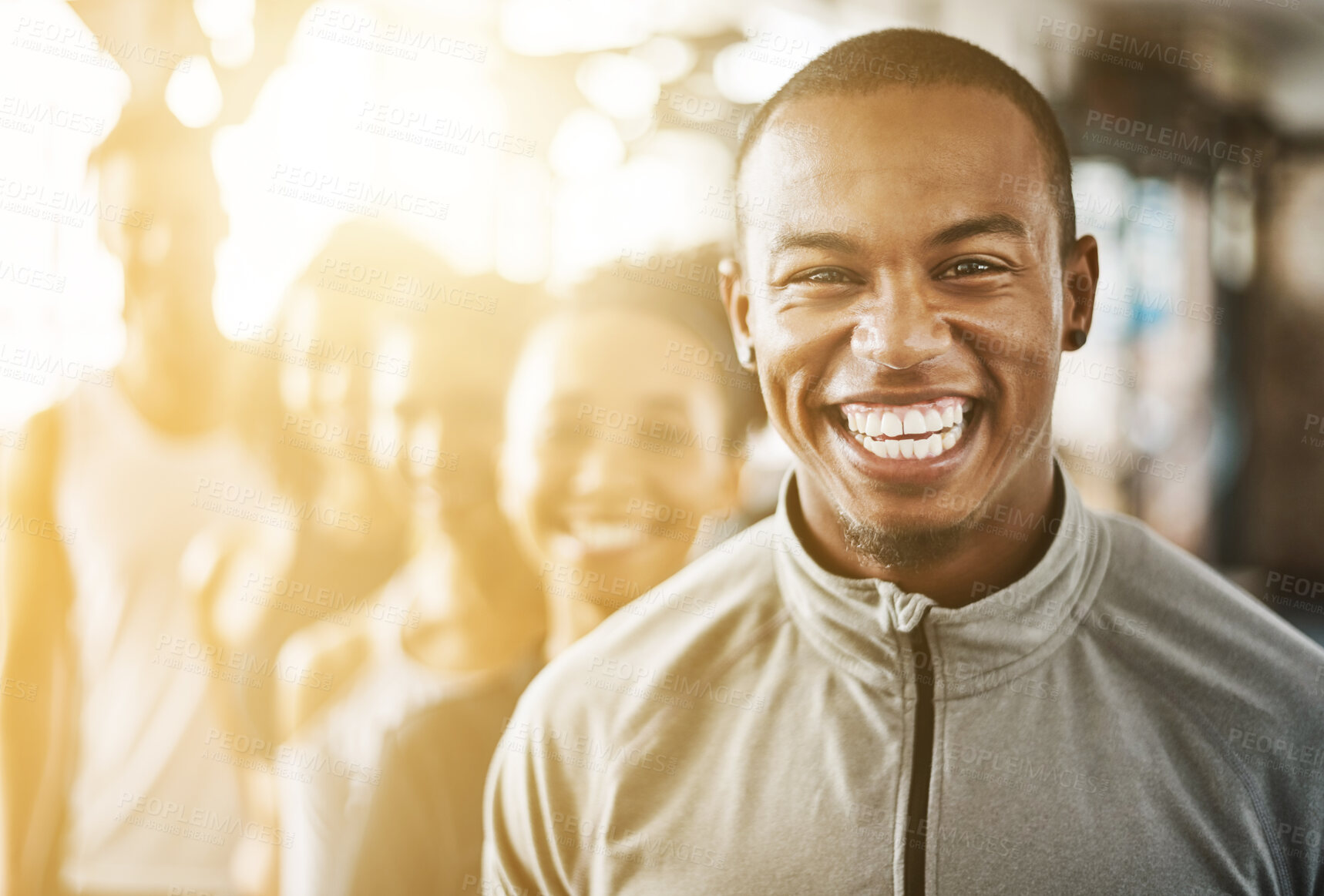 Buy stock photo Fitness, black man and portrait with team, workout class and training in a health and wellness club. Lens flare, happy and smile with diversity and personal trainer with exercise, sports and group