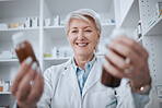 Happy senior woman, pharmacist and medicine for inventory inspection or checking stock on shelf at store. Mature female person, medical or healthcare worker reading pharmaceutical product at pharmacy