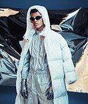 Holographic, vaporwave clothes and man with fashion and futuristic ski style with sci fi in studio. Art, creative and young male model with trendy, cool sunglasses and cyberpunk designer jacket