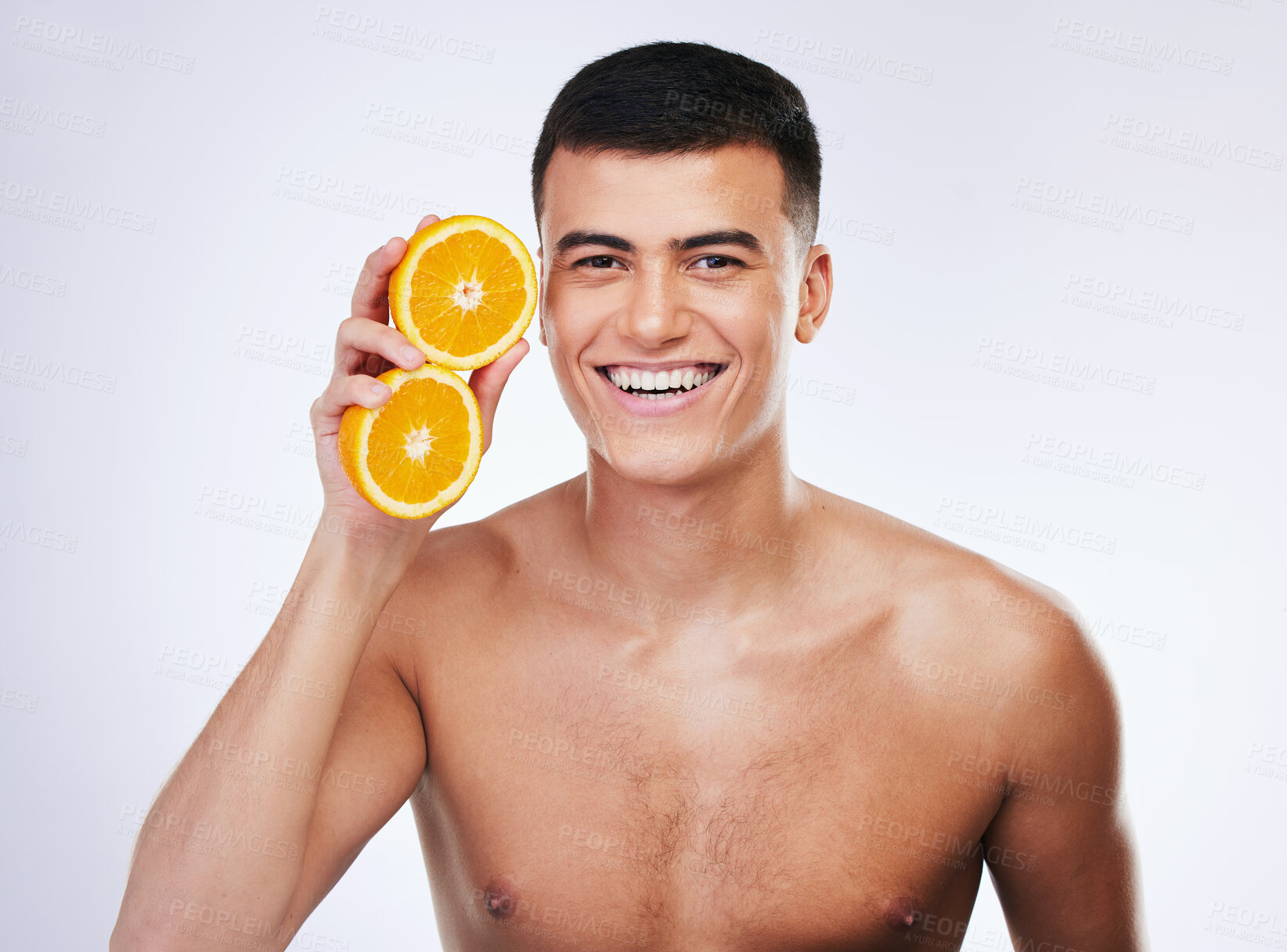 Buy stock photo Skincare, orange and wellness with portrait of man in studio for health, detox and natural cosmetics. Vitamin c, nutrition and summer with face of person and fruit on white background for self care