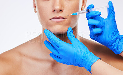 Buy stock photo Man, syringe and lip filler surgery in studio with doctor for beauty, wellness or facial change by white background. Young model, needle and hands for mouth, cosmetic transformation and dermatology