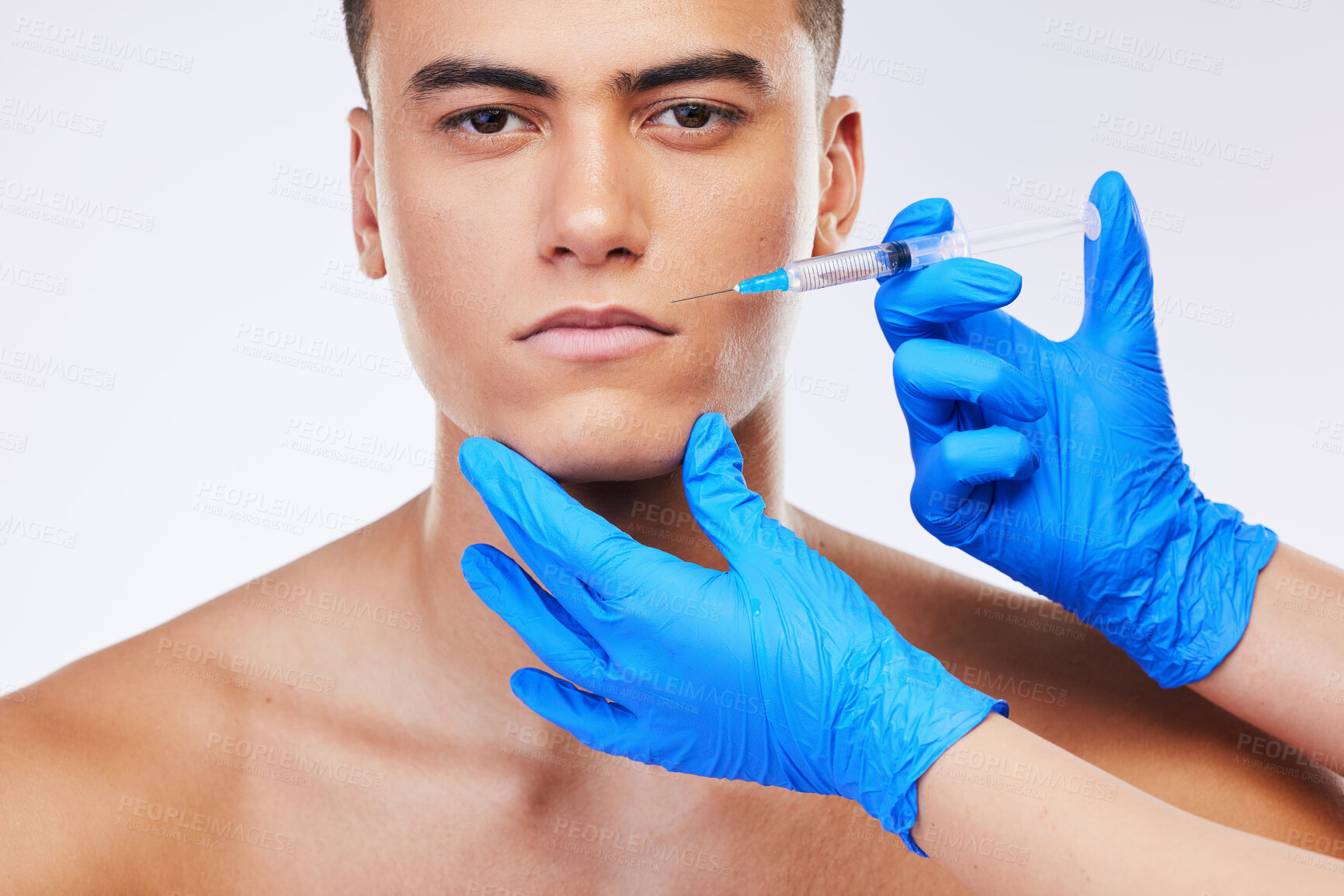 Buy stock photo Man, needle and lip filler surgery in studio portrait for beauty, wellness or facial change by white background. Young model, syringe and hands for mouth, cosmetic transformation and dermatology