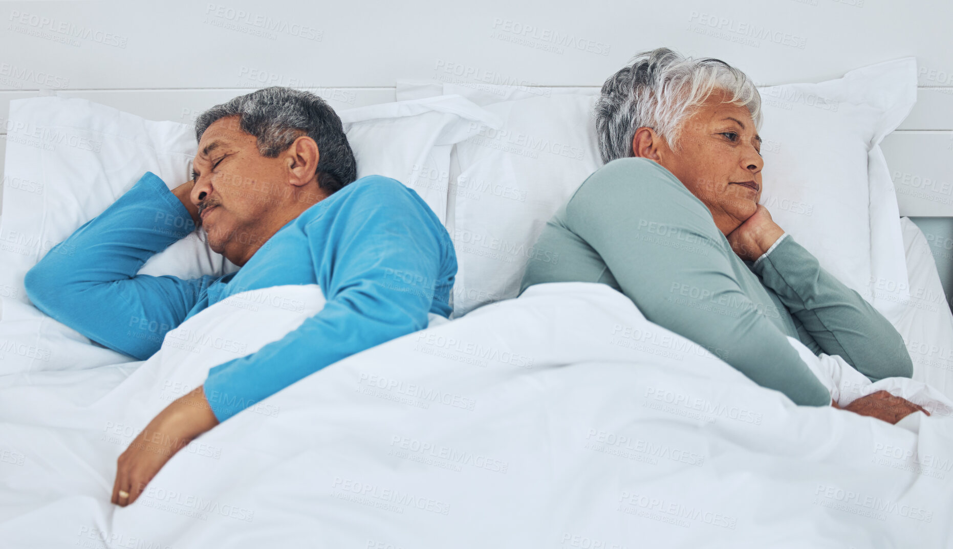 Buy stock photo Sleeping, fighting and a senior couple in a bed with insomnia in a marriage together. Conflict, tired and elderly man and woman in the bedroom for rest in divorce and a nap with thinking in a house