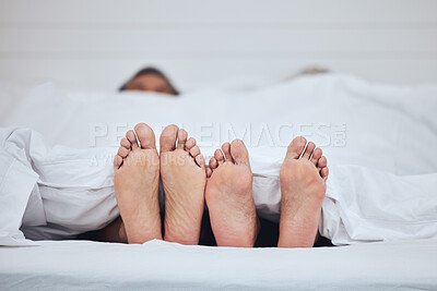 Buy stock photo Couple, bed and feet with blanket in sleeping, peace and morning rest together on weekend at home. Barefoot people, asleep and comfort in bonding, care or love under duvet in bedroom at the house