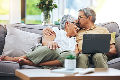 Buy stock photo Laptop, love and senior couple on sofa for watching movies, entertainment or streaming in living room. Retirement, marriage and happy man and woman kiss on computer for bonding, relax or film at home