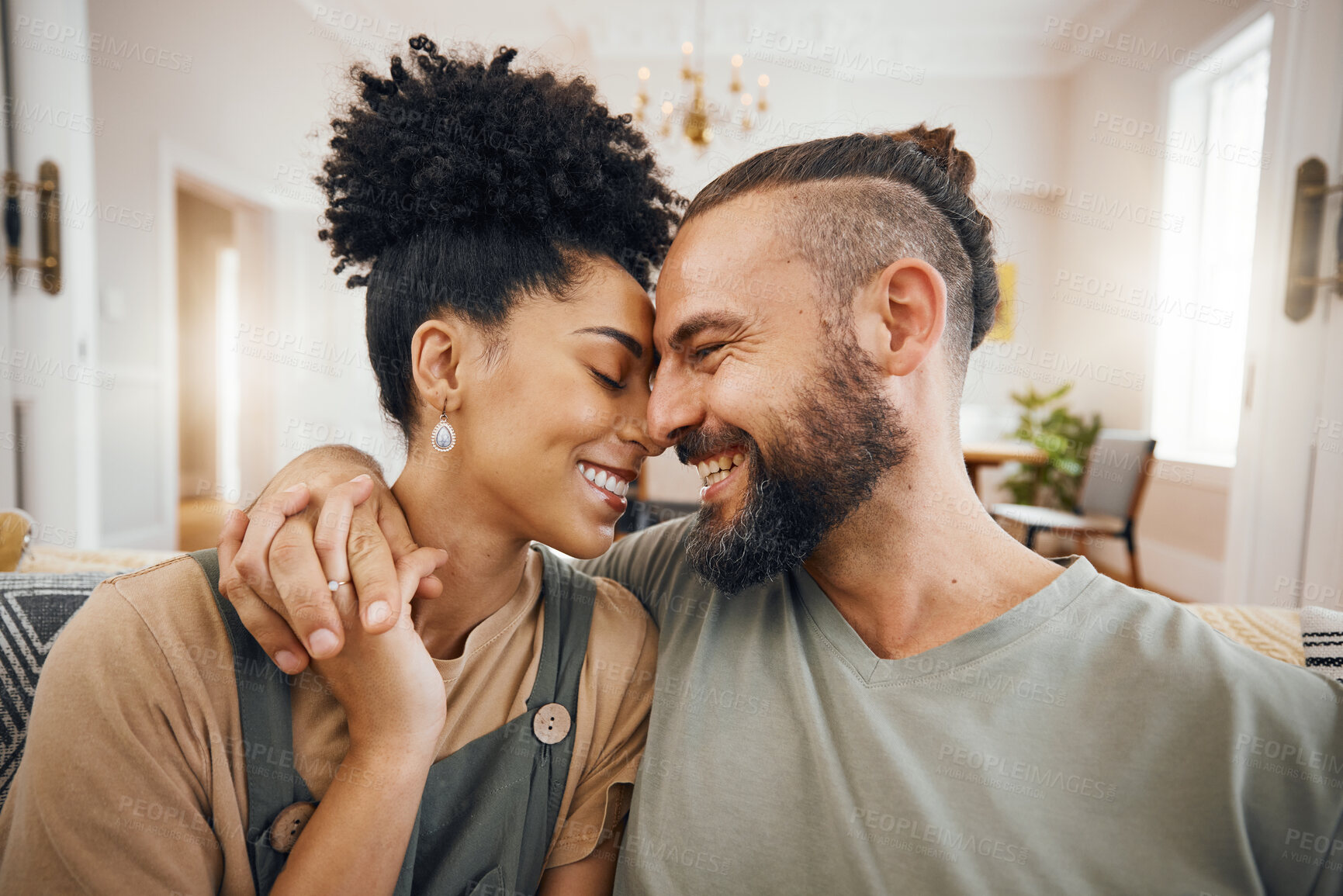 Buy stock photo Home, forehead or couple with love, smile or romantic with happiness, relationship or relax in a lounge. Commitment, man or woman on a sofa, marriage or romance with bonding, trust or loving together